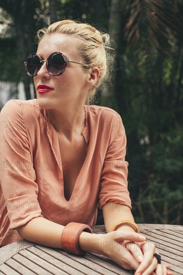 Caucasian woman sitting at table