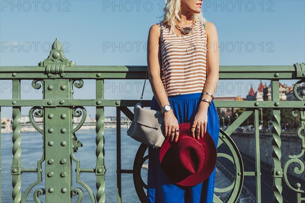 Caucasian woman standing on bridge