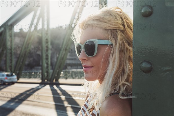 Caucasian woman standing on bridge