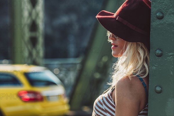 Caucasian woman standing on bridge