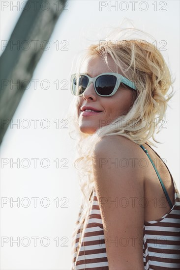 Caucasian woman in sunglasses outdoors