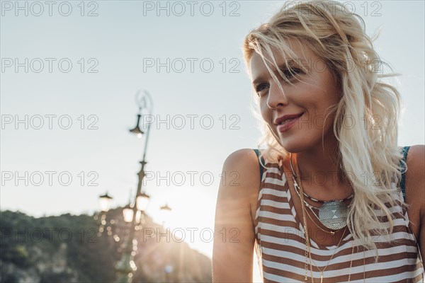 Caucasian woman against blue sky