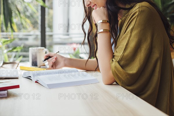 Caucasian woman studying at desk