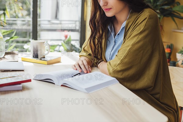 Caucasian woman studying at desk