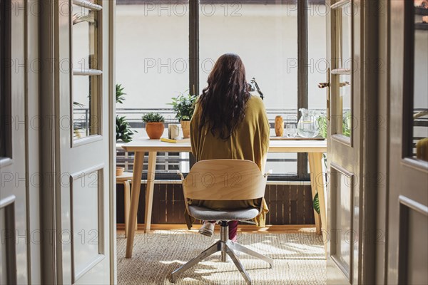 Caucasian woman sitting at desk