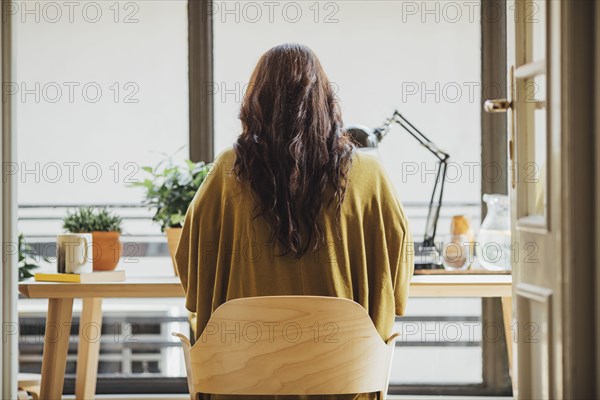 Caucasian woman sitting at desk