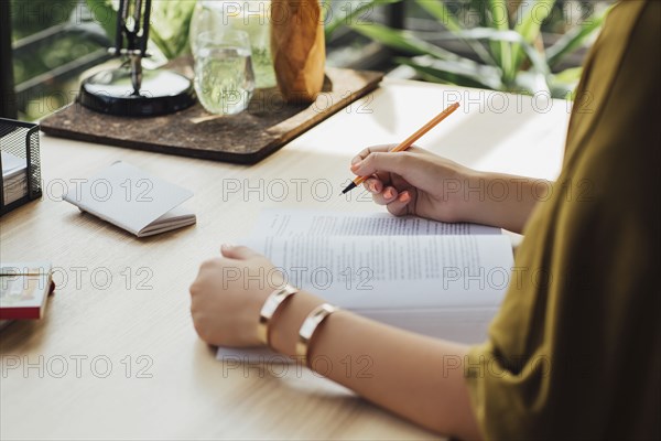 Caucasian woman studying at desk