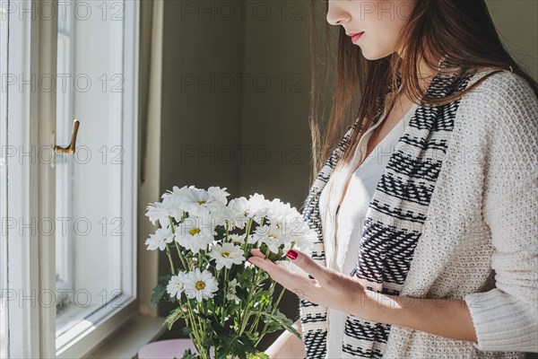 Woman arranging flowers