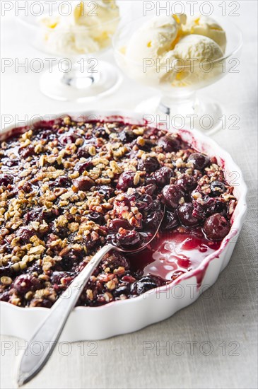 Spoon in cherry crisp