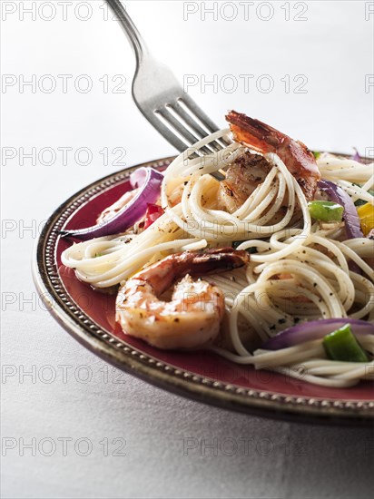 Fork twirling spaghetti with shrimp