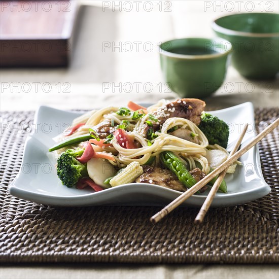 Stir fry on plate with chopsticks