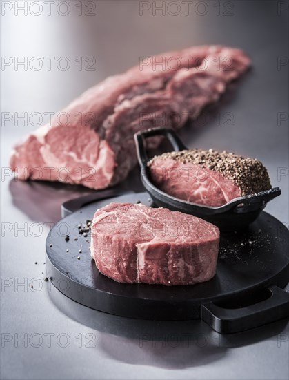 Raw beef tenderloin with pepper coating