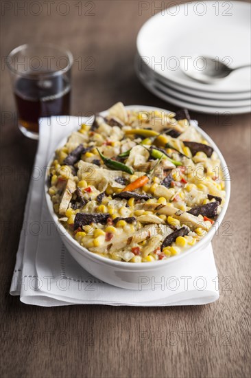 Bowl of Mexican tortilla casserole with corn