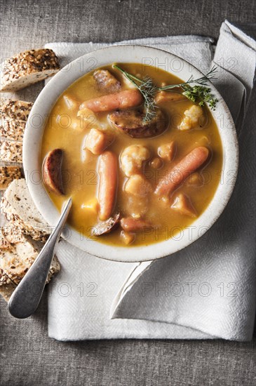 Bowl of stew with bread and napkin