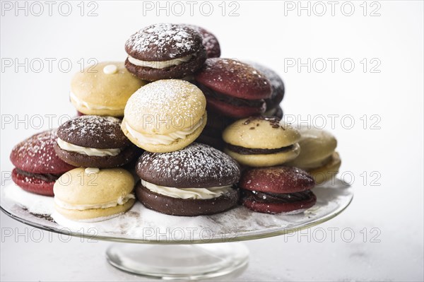 Powdered sugar on tray of cookies