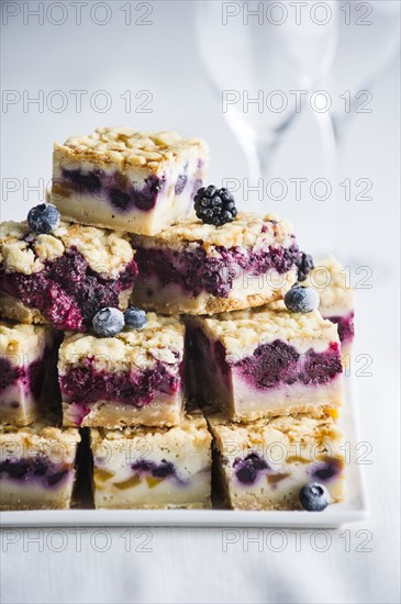 Pile of berry cobbler slices on tray