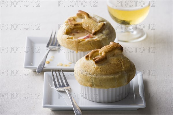 Pot pies with forks on plates
