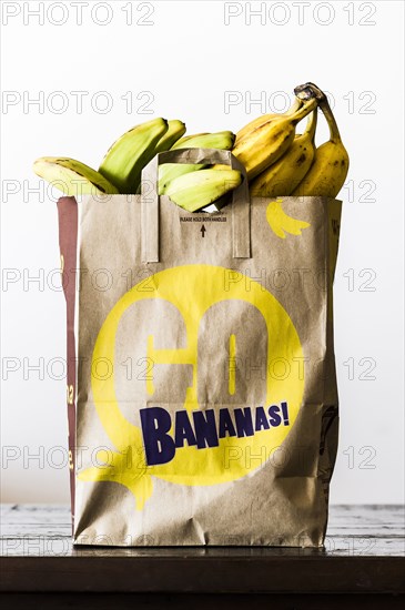 Brown paper bag of bananas