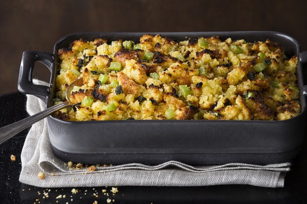 Spoon in tray of stuffing