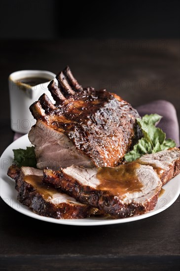 Sliced rack of pork on plate