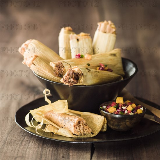 Bowl of tamales with salsa