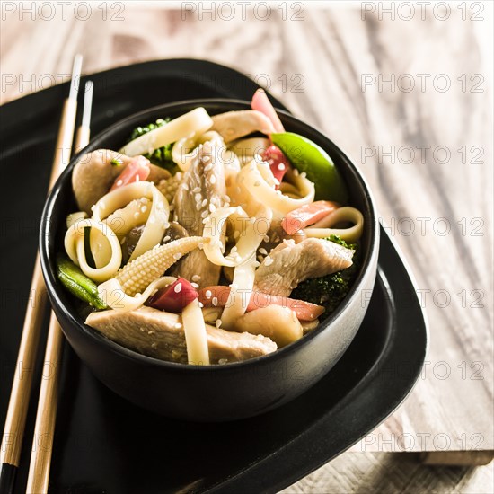 Bowl of stir fry chicken and vegetables