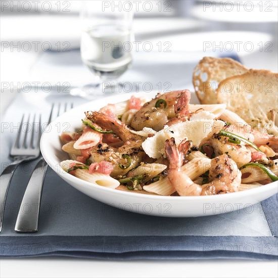 Plate of shrimp and pasta with bread