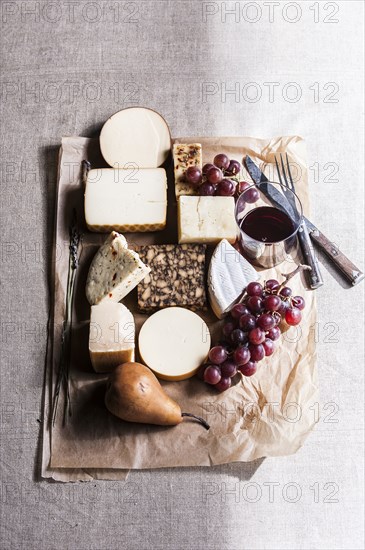 Assorted cheese and fruit with wine