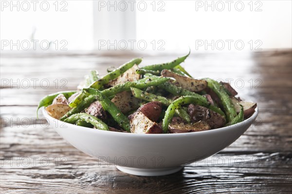 Bowl of green beans and roasted potatoes