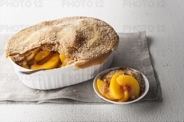 Serving of peach cobbler