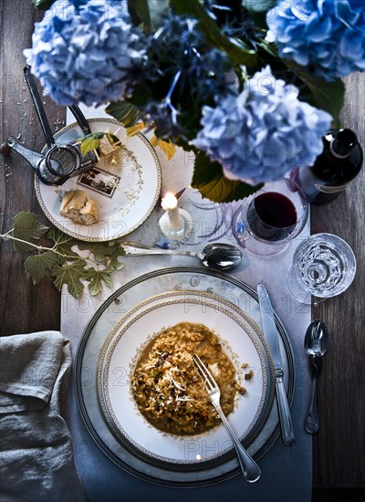 Mushroom risotto meal with wine