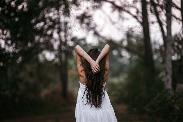 Caucasian woman standing in forest