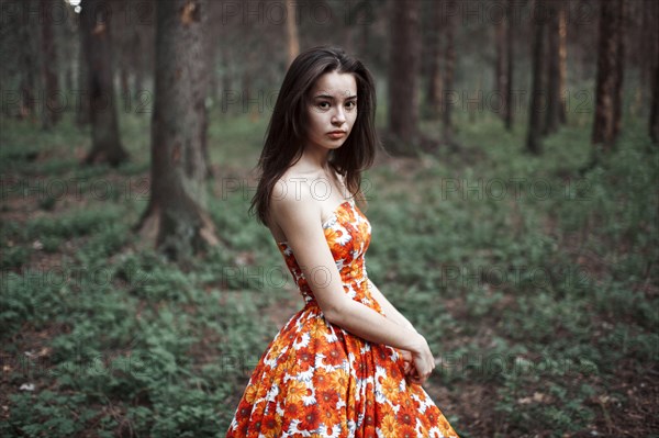 Caucasian woman standing in forest