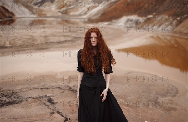 Caucasian woman walking in remote landscape