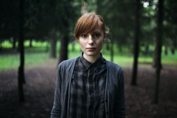 Caucasian woman standing in forest