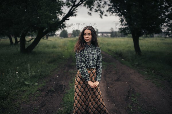 Caucasian woman standing on remote path