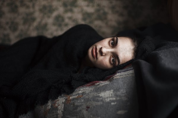 Caucasian woman laying on sofa