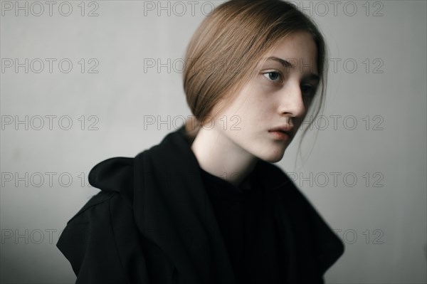 Caucasian woman with serious expression