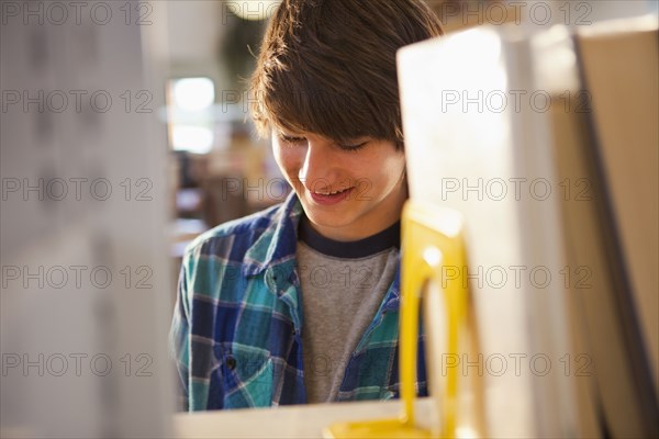 Mixed race boy in library