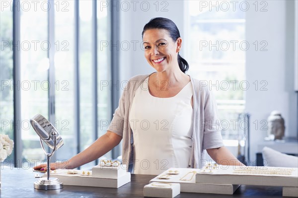 Hispanic woman working in jewelry store