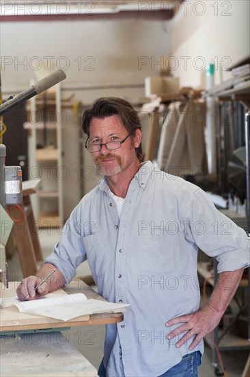 Caucasian carpenter in workshop