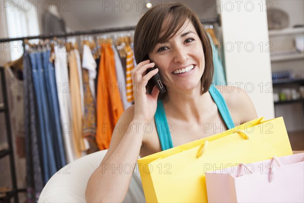 Hispanic woman shopping in clothing store