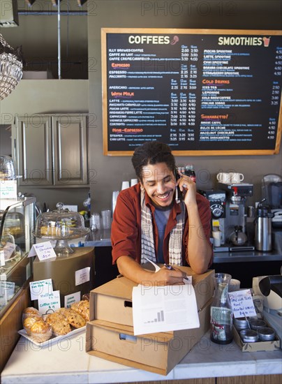 Mixed race man working in coffee shop