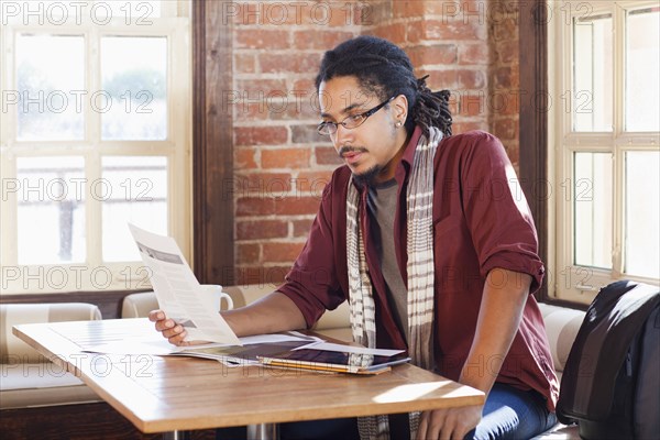 Mixed race man working in coffee shop