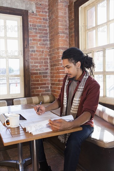 Mixed race man working in coffee shop