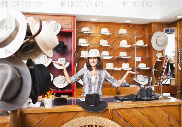 Ecuadorian woman working in hat store