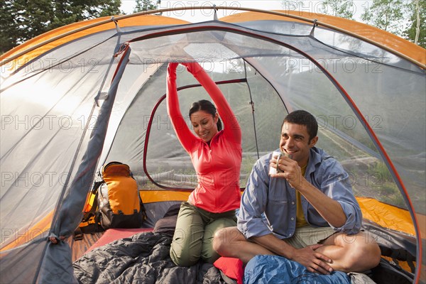 Couple sitting in tent