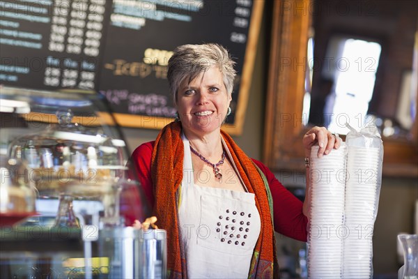 Caucasian woman working in coffee shop