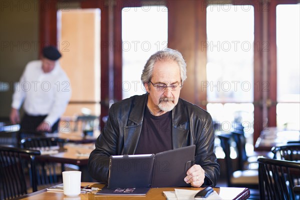 Caucasian man using tablet computer