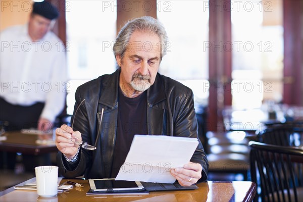 Caucasian man using tablet computer